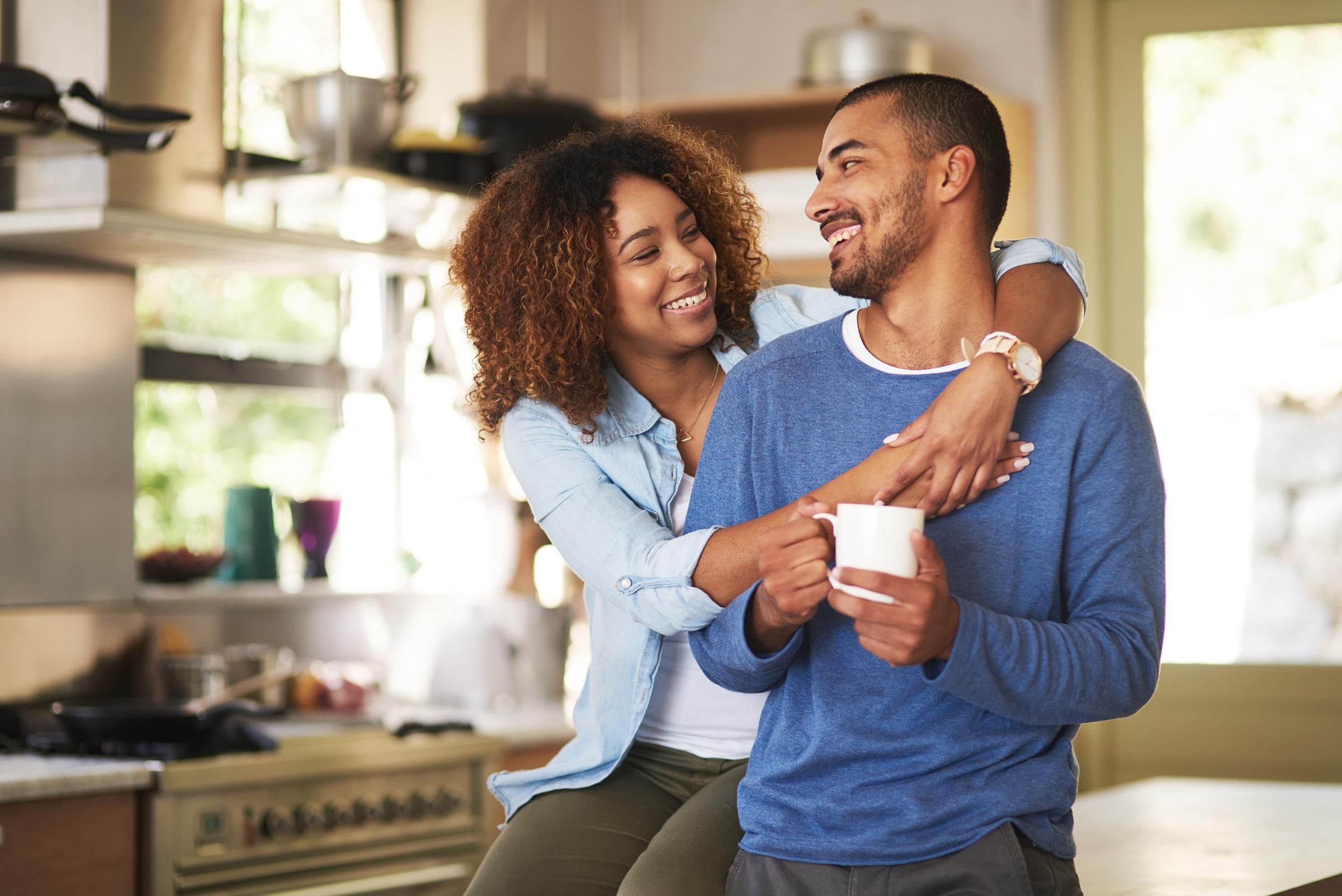 Shot of a happy young couple feeling relaxed in the at home.